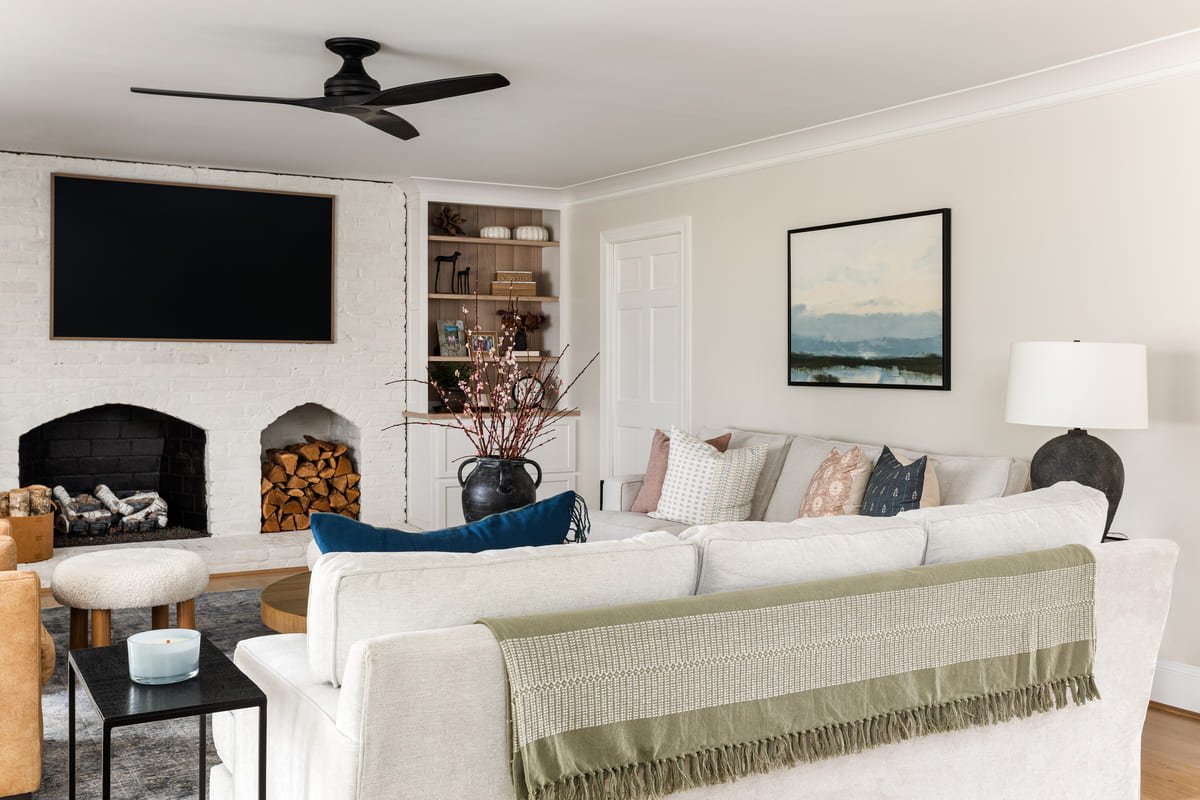 Living room with built in shelving flanking the fireplace