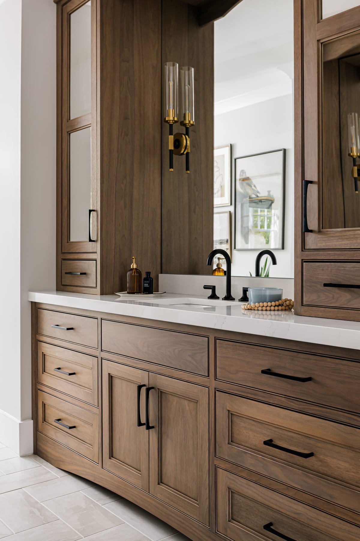 Walnut double vanity with a full height storage tower and black fittings